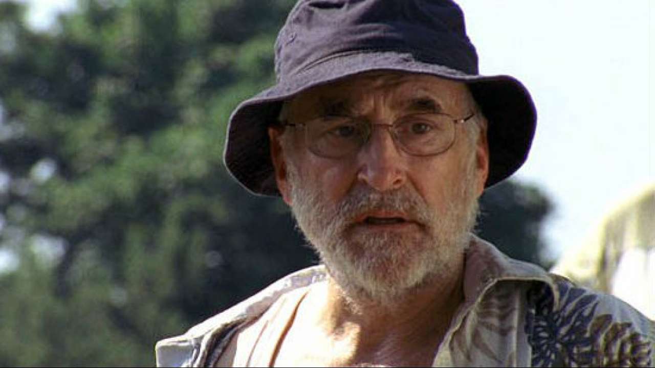 Jeffrey  DeMunn wearing hat and spectacles.