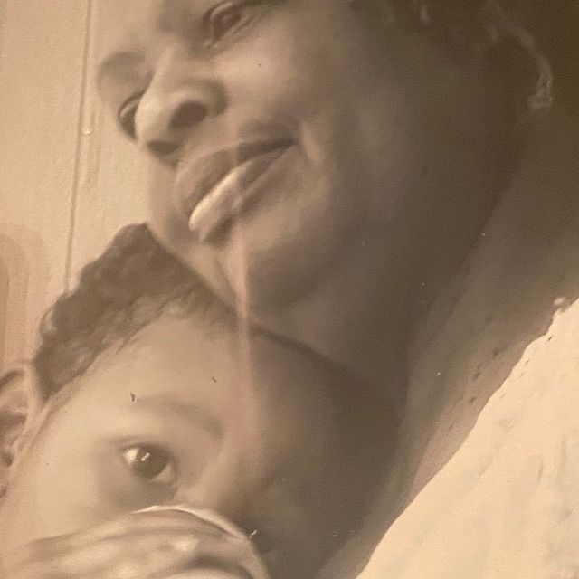 Childhood picture of Jerry Jr. with his grandmother hugging each other.