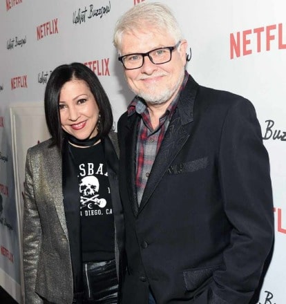 The couple are wearing a black and dark-silver coat .