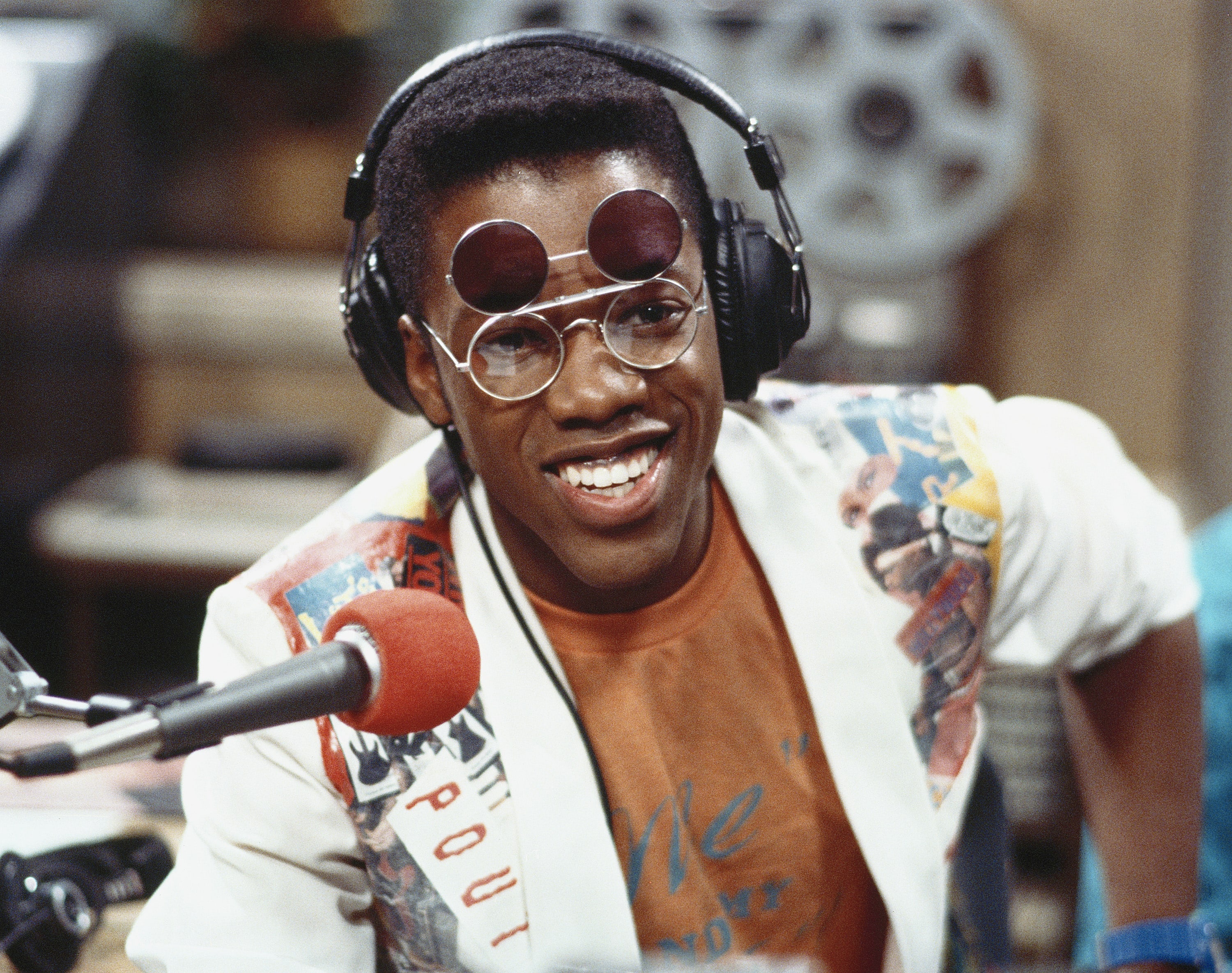 Kadeem Hardison  wearing headset and sunglass.