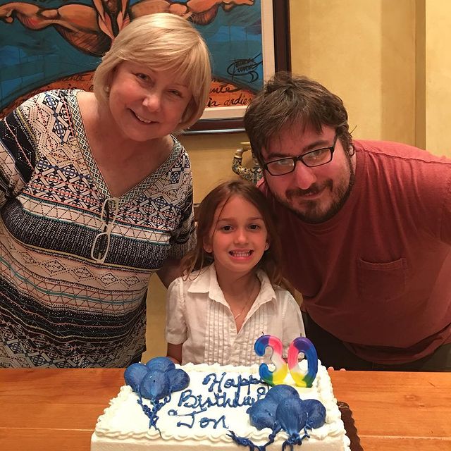 Cristina wear t-shirt and her son wearing red t-shirt.