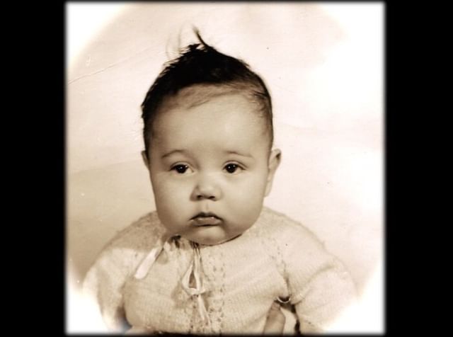 Fernando wearing child hood dress. 