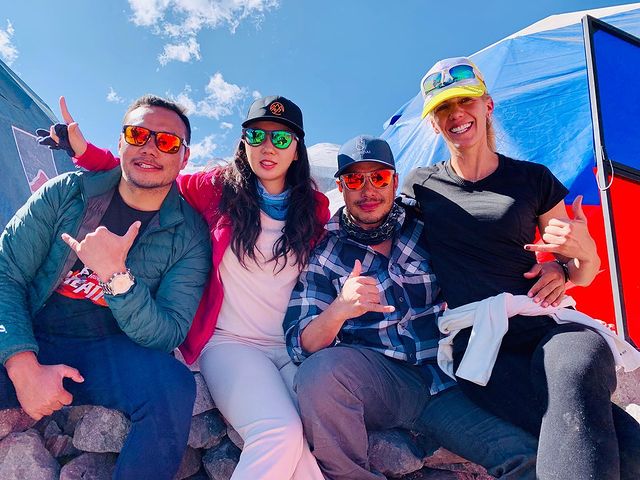 Céline Nha Nguyen posing with the Nirmal Purja and  Lakpa Dendi Sherpa and her one friend in Plaza De Mulas, Aconcagua Base Camp