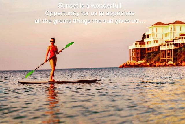 Céline Nha Nguyen posing with paddle in the middle of the sea