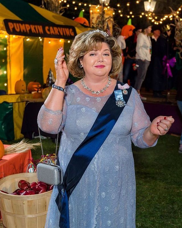 Pictures of Catherine Disher posing for her photoshoot  wearing blue color gown