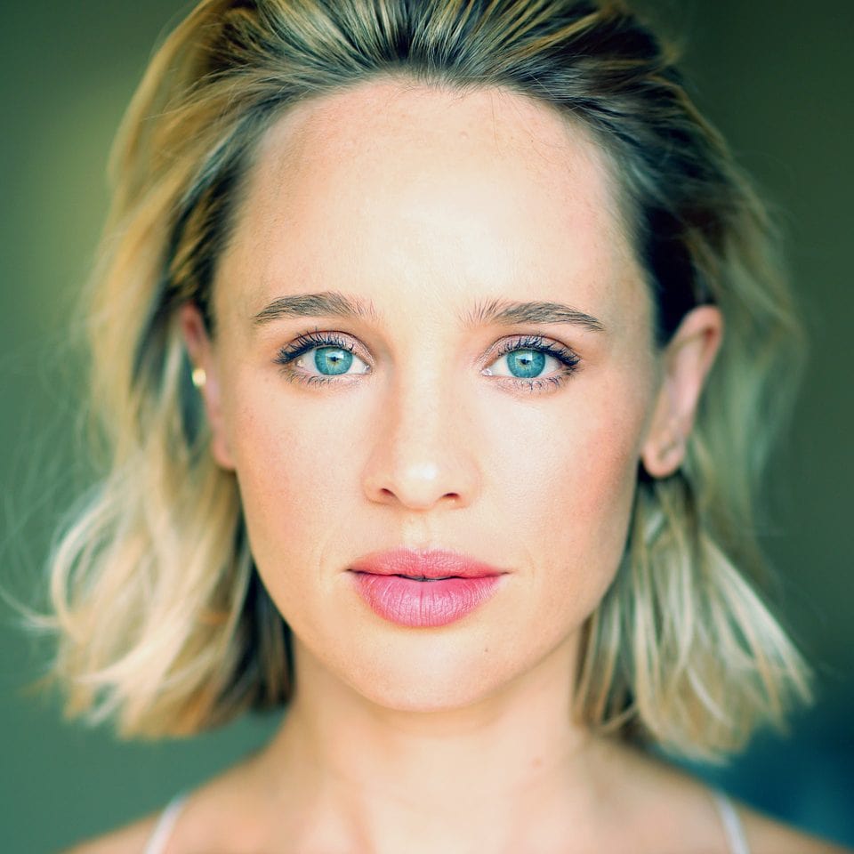 Natasha Loring in a short grey brown hair with a smiley face and  in a sparkling blue eyes