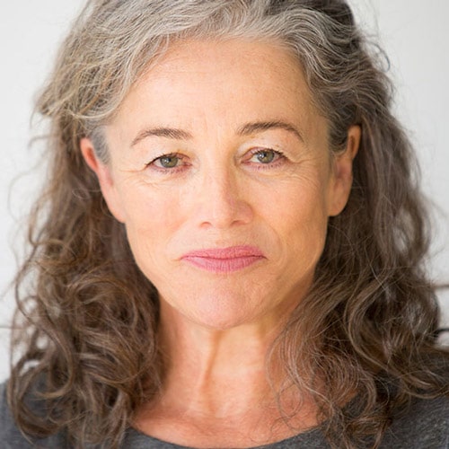 Sarah Peirse in a smiley face with a black and white short hair