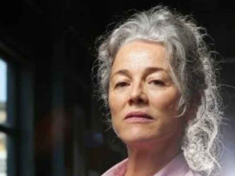 Sarah Peirse in a smiley face with a white short hair