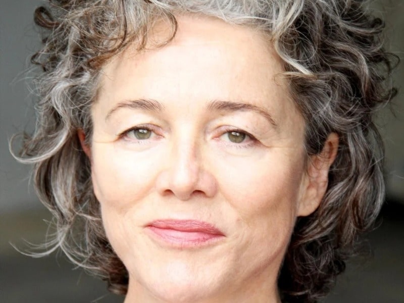 Sarah Peirse in a smiley face with a black and white short hair