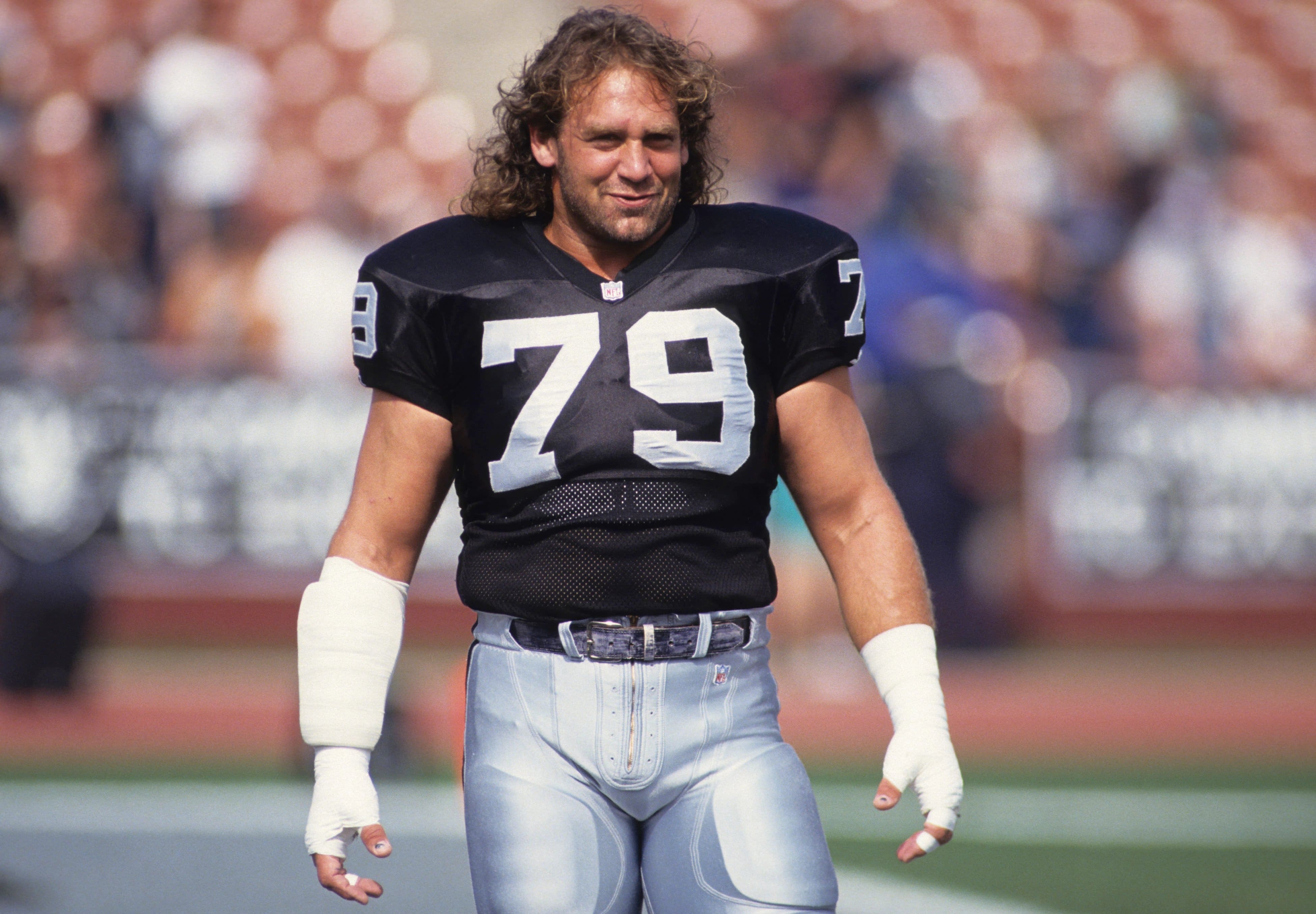 Bob Golic wearing jersey in the stadium