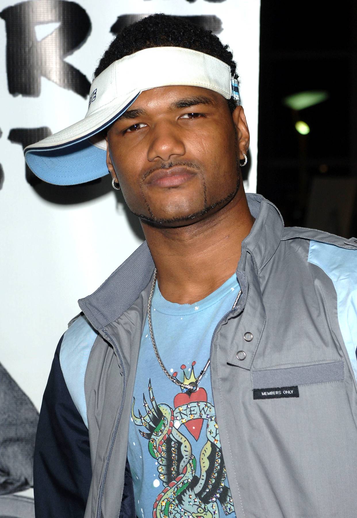 Damien Dante Wayans wearing white cap 