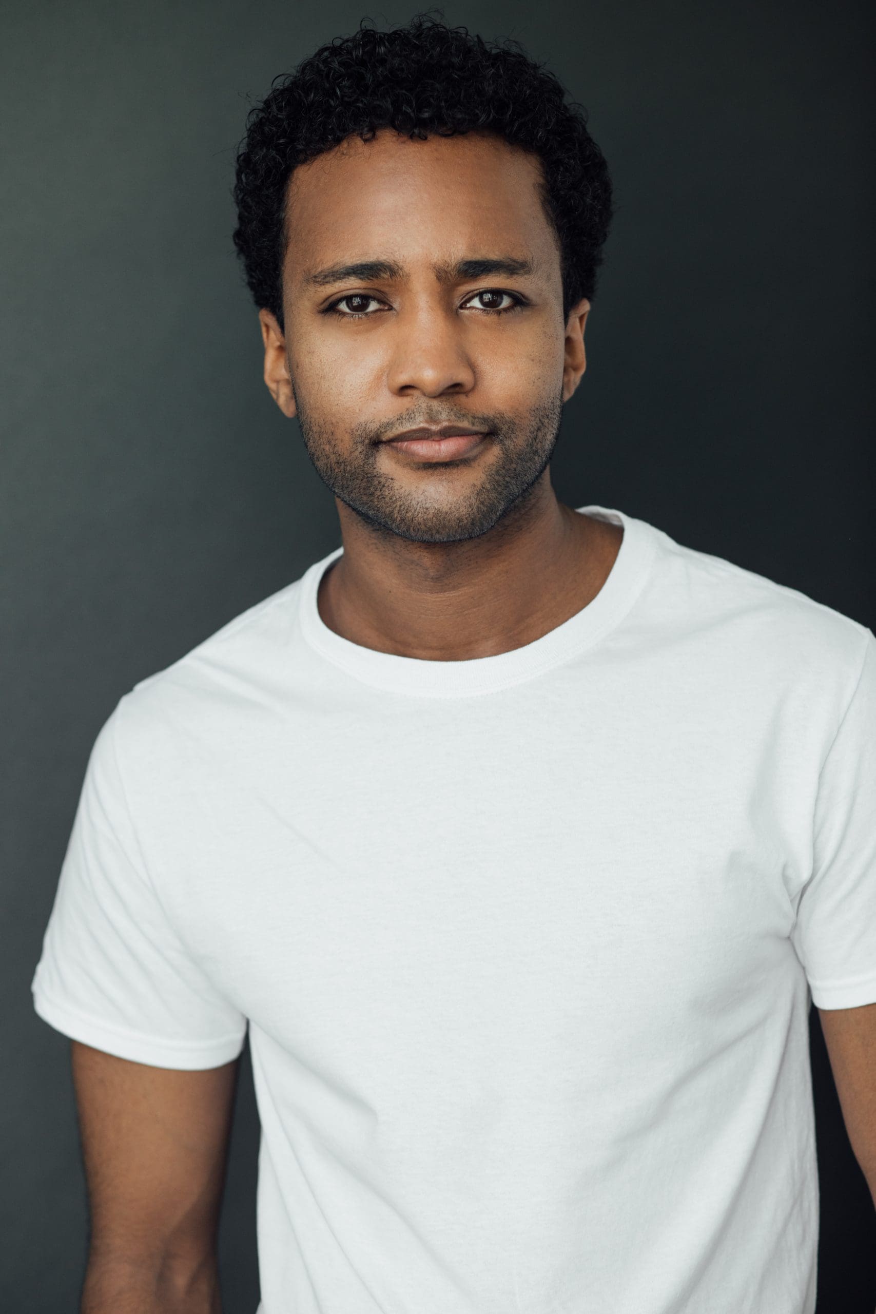 Dalmar Abuzeid posing for the photographs wearing white tshirt