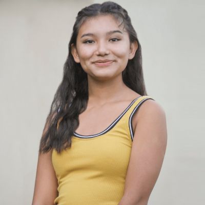 Kiawentiio Tarbell in a smiley face wearing light yellow t-shirt