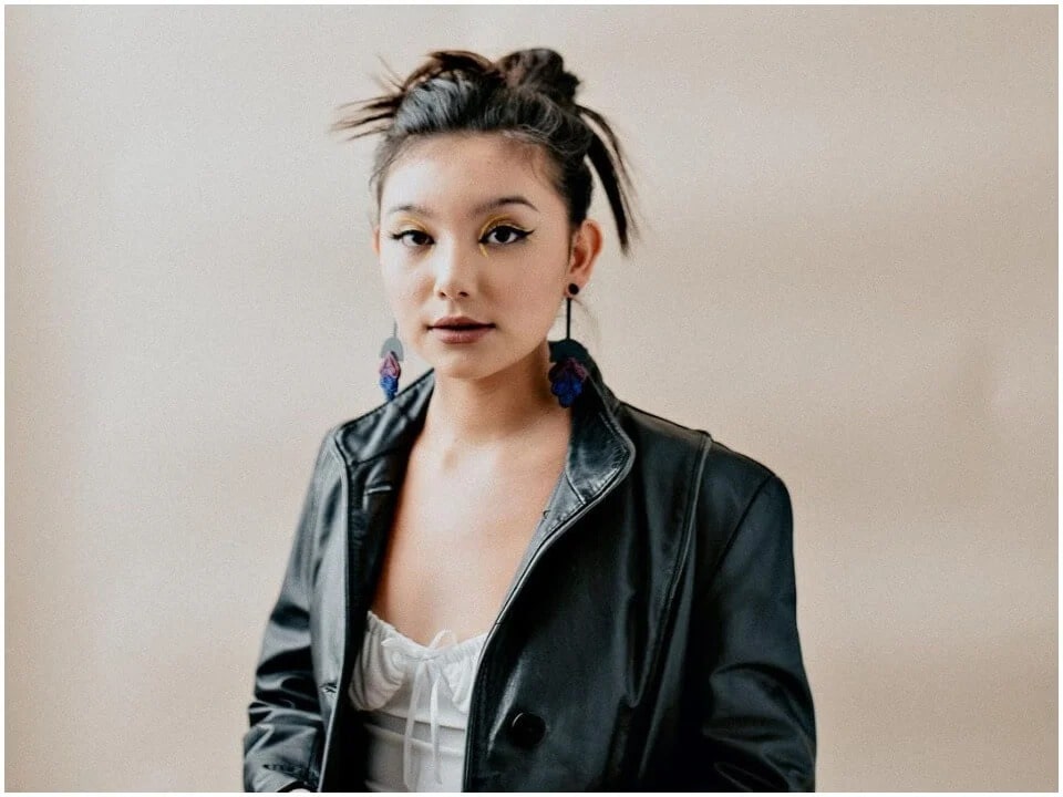 Kiawentiio Tarbell posing for photo wearing black leather jacket