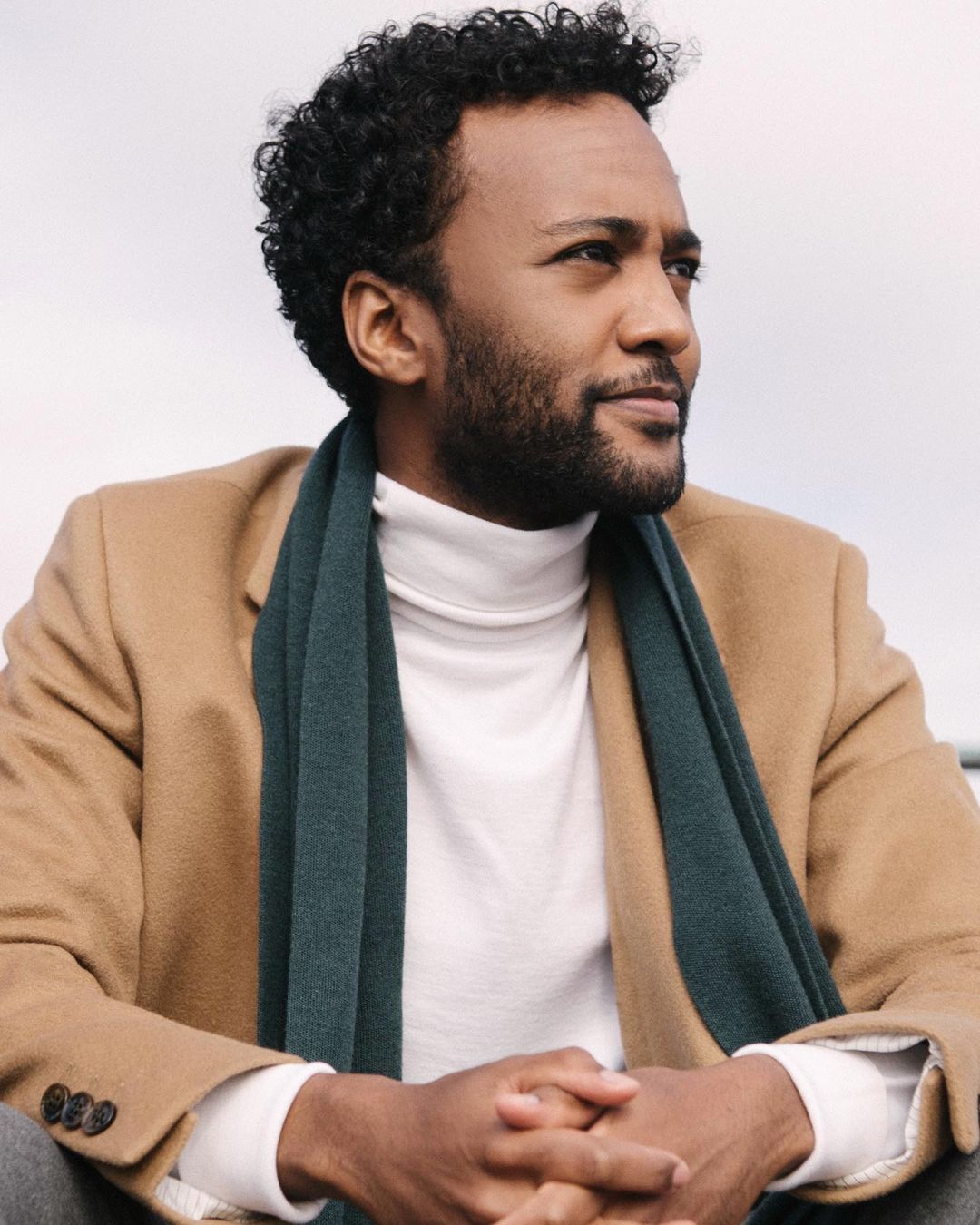 Dalmar Abuzeid posing for the photographs looking at the left side 