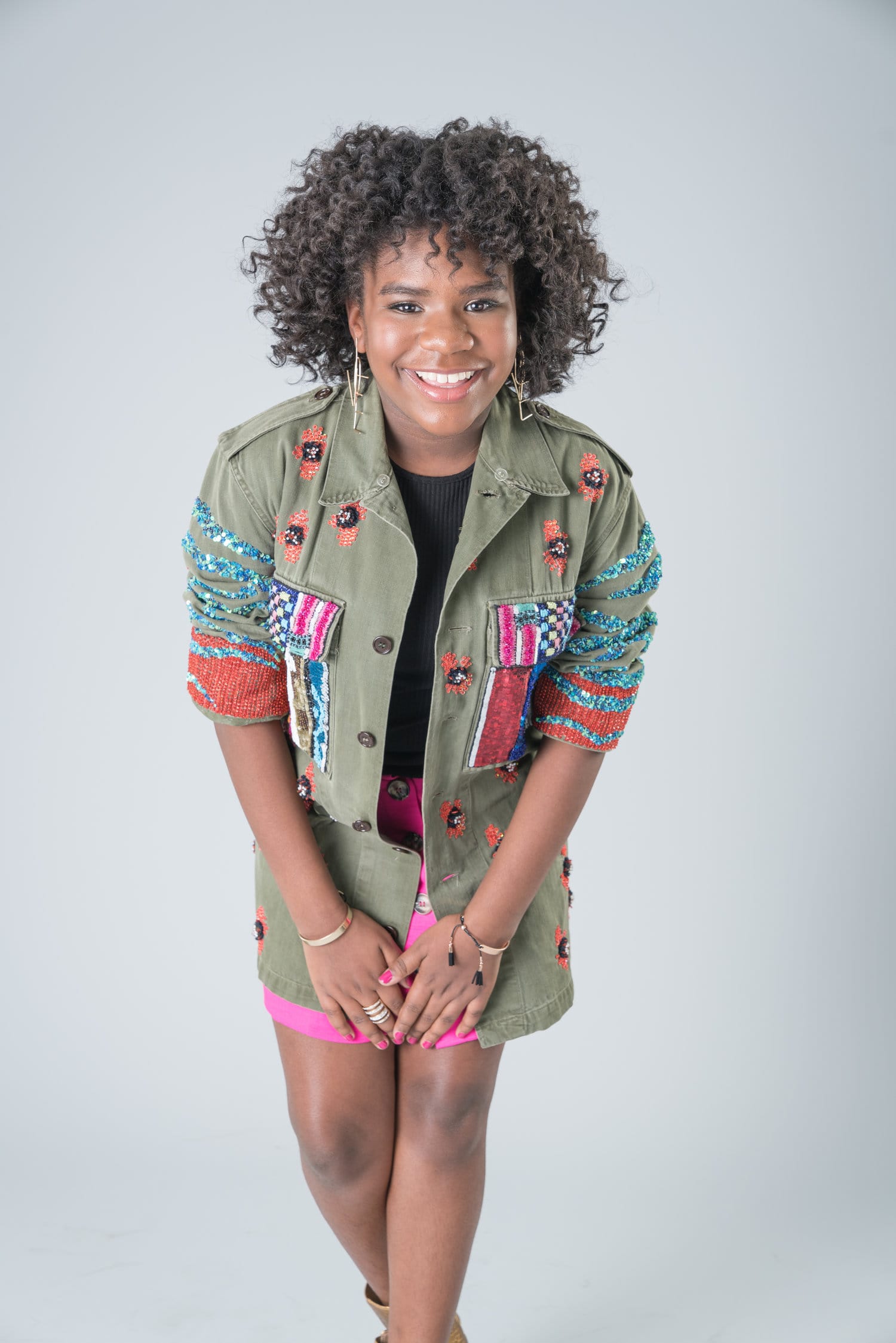 Trinitee Stokes with posing for the photo with a black curly hair