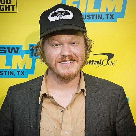 Picture of James Robert Plemons's father Jesse Plemons posing for a photoshoot wearing black color cap and blazer
