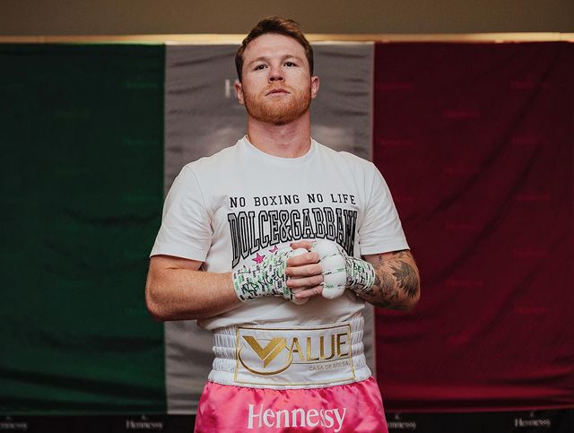 Picture of Saúl Adiel Alvarez's father Canelo Alvarez posing for a photoshoot wearing boxing gloves