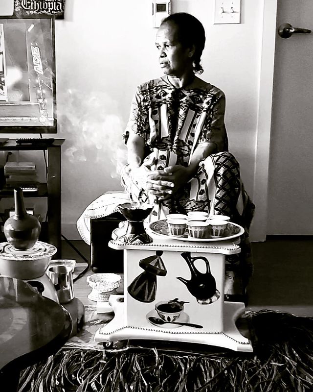 Picture of Solomon Georgio's mother posing for a photoshoot wearing gown