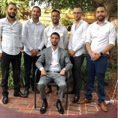 Picture of Anuwar Jibawi with his Five brothers during an event.