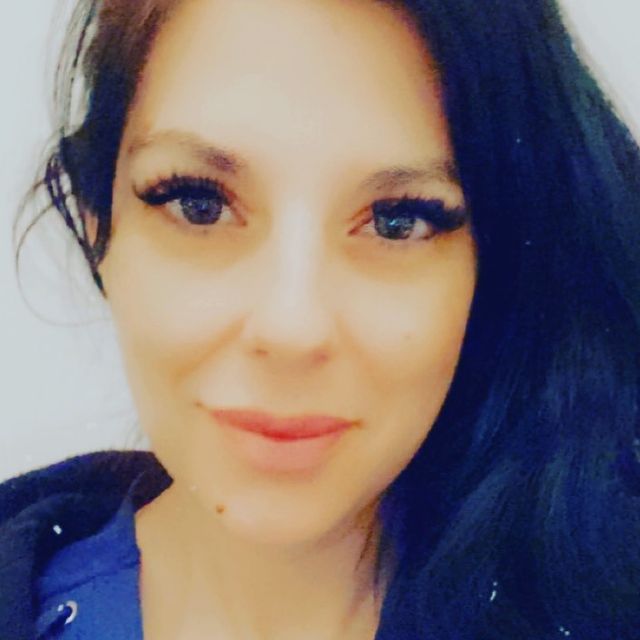 Picture of Jenna Morasca posing a for a photoshoot wearing blue color dress