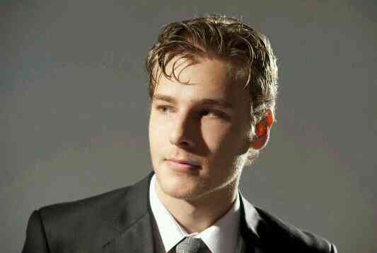 Anthony Ingruber was captured in his side looks wearing white shirt and black coat 