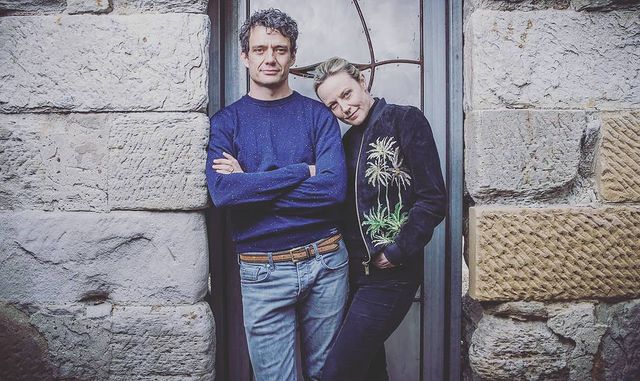 Picture of Benjamin Winspear with his wife Marta Dusseldorp posing for a photoshoot wearing blue color t shirt and jeans pant 