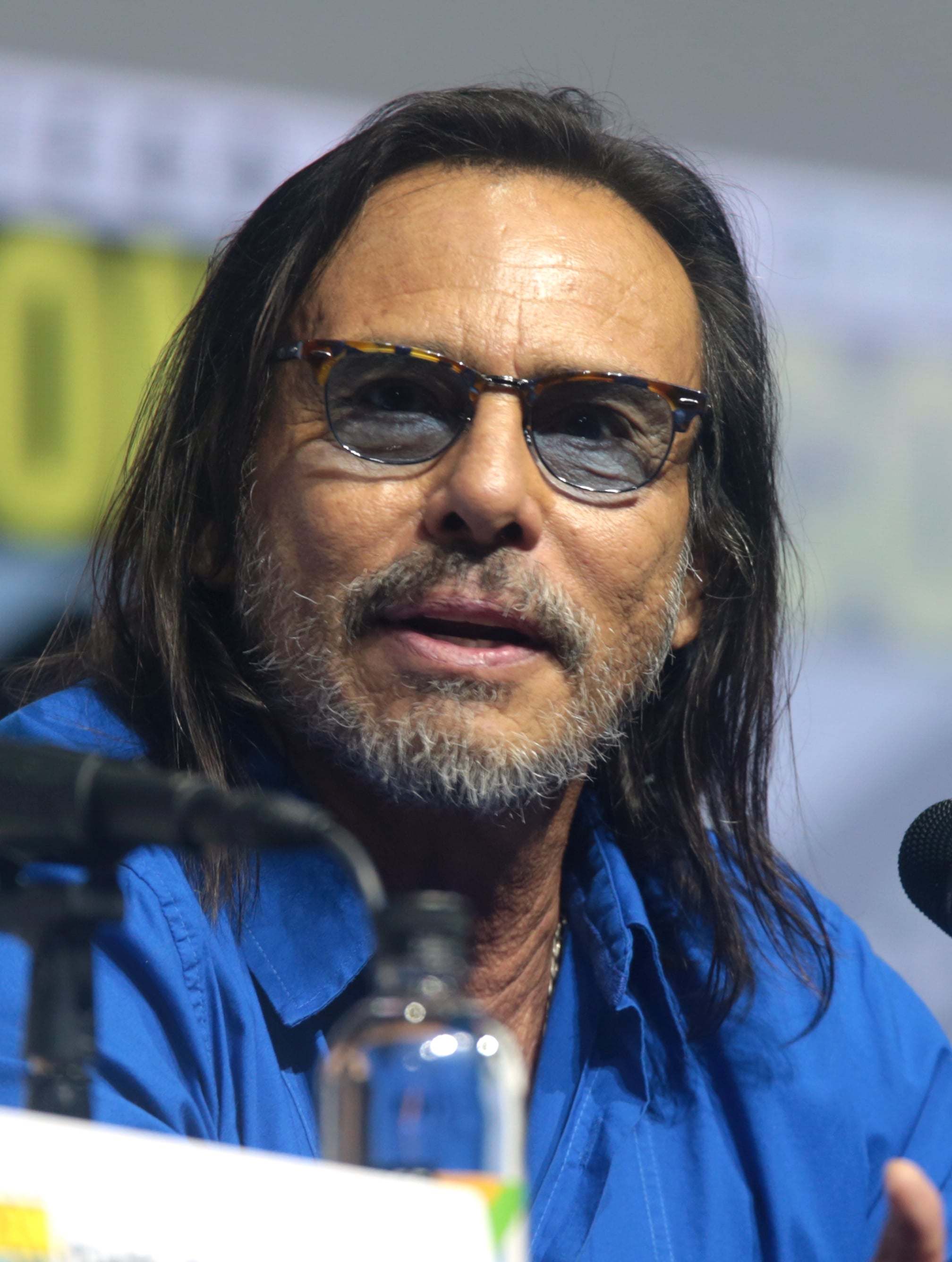 Raoul Trujillo was captured posing for the photo wearing hat and his hand on his cheek