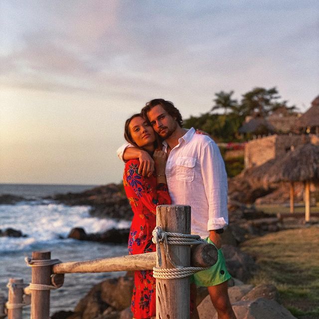 Picture of Jon-Michael Ecker with his girlfriend Laura James wearing white shirt and half pant