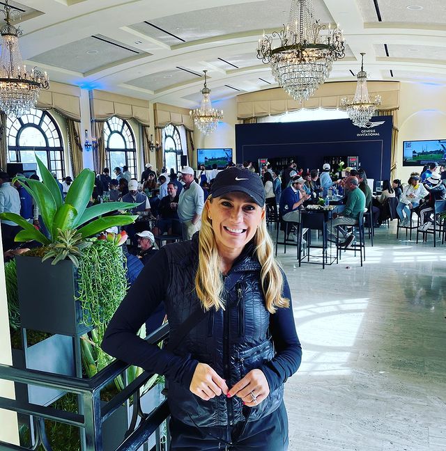 Amber Theoharis in The Genisis Invitational during New Year wearing black dress