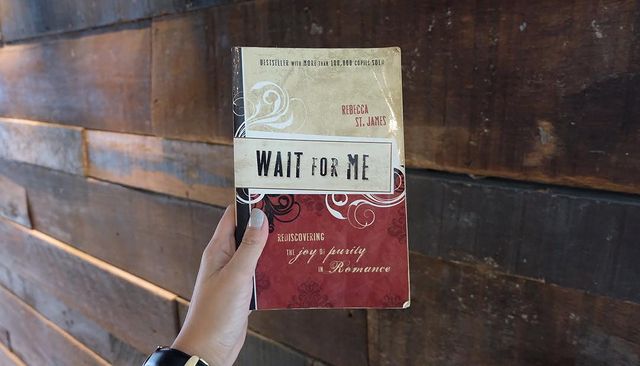 Picture of Roxanne Barcelo holding "Wait for Me" book