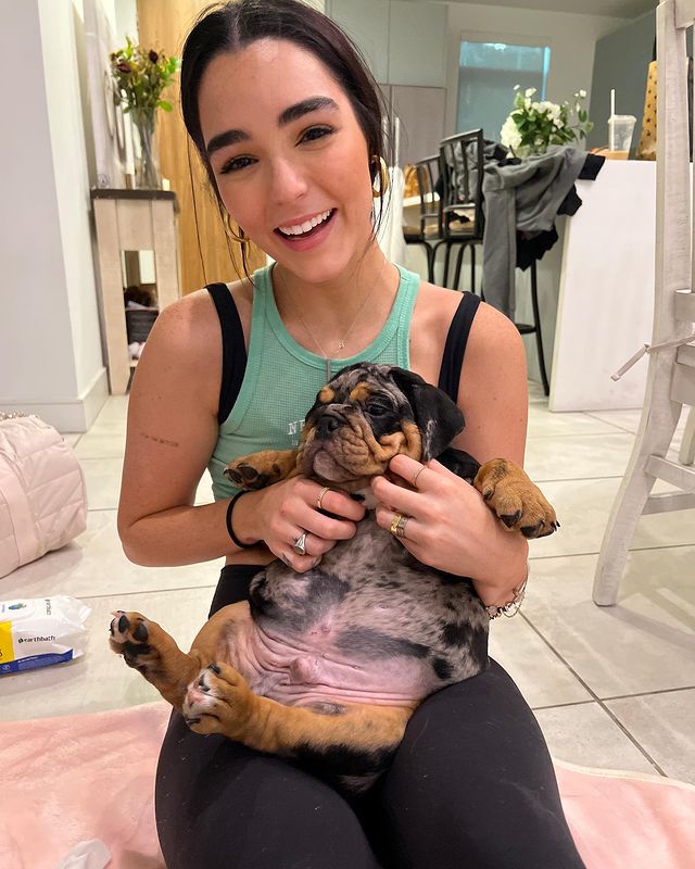 Indiana Massara posing for a photo shoot for her Instagram feed.