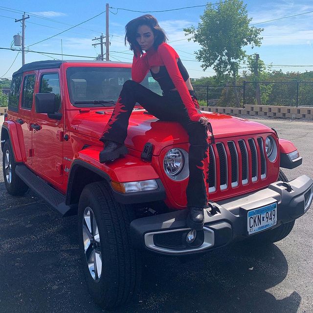 Indiana Massara posing for a photo shoot for her Instagram feed.