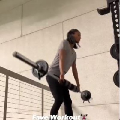 Photo of Nicole Fiscella in Gym while lifting weights.