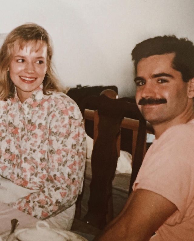 Picture of Brooke Palsson's father Dan Palsson and mother Brenda Palsson posing for a photoshoot wearing pink color dress