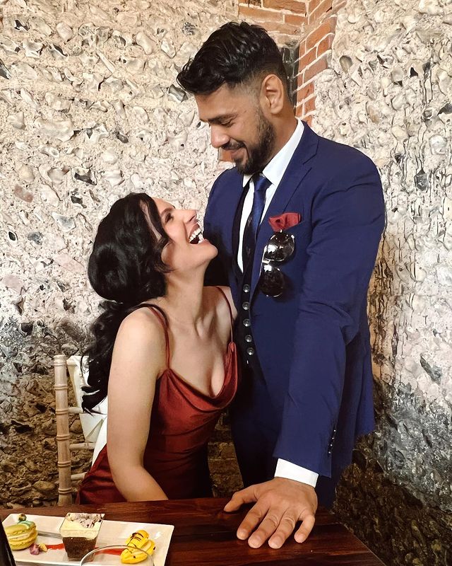 Picture of  Brooke Palsson with her boyfriend wearing red color gown 