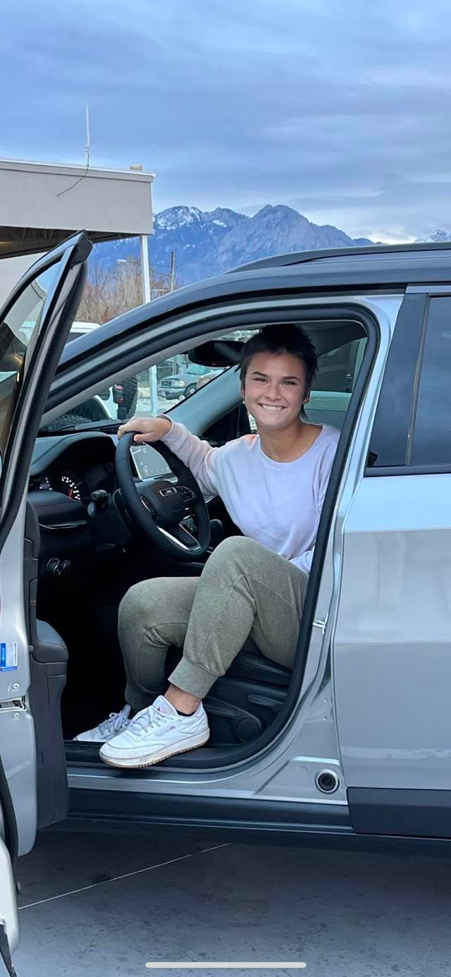 Picture of Elizabeth Theroux's daughter Rhys Clem and her car