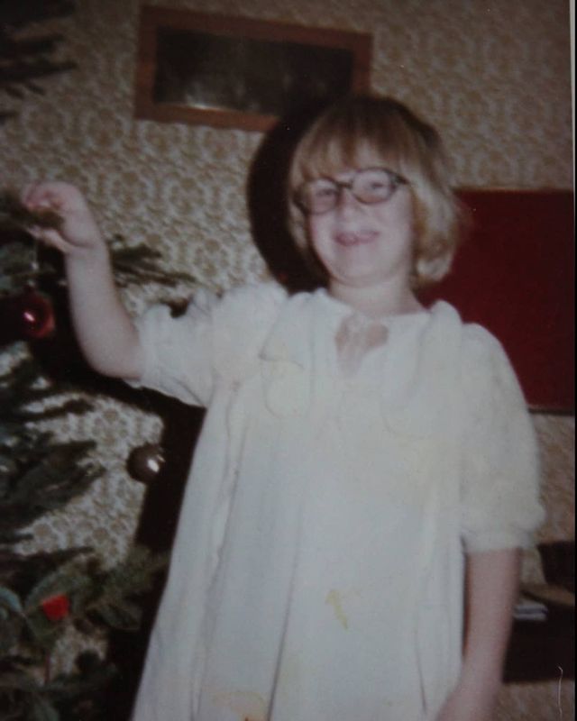 Childhood picture of Jackie Torrens posing for a photoshoot wearing white color dress