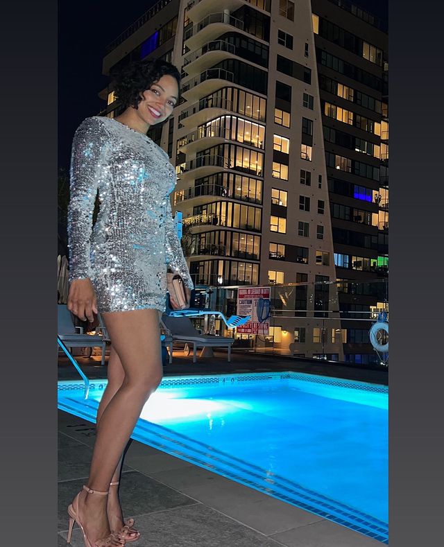 Picture of Shailene Garnett posing for a photoshoot wearing heels and silver color dress