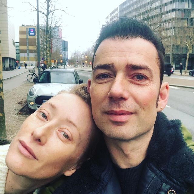 Picture of Maria Erwolter with her boyfriend Laust Sonne posing for a photoshoot wearing white color dress