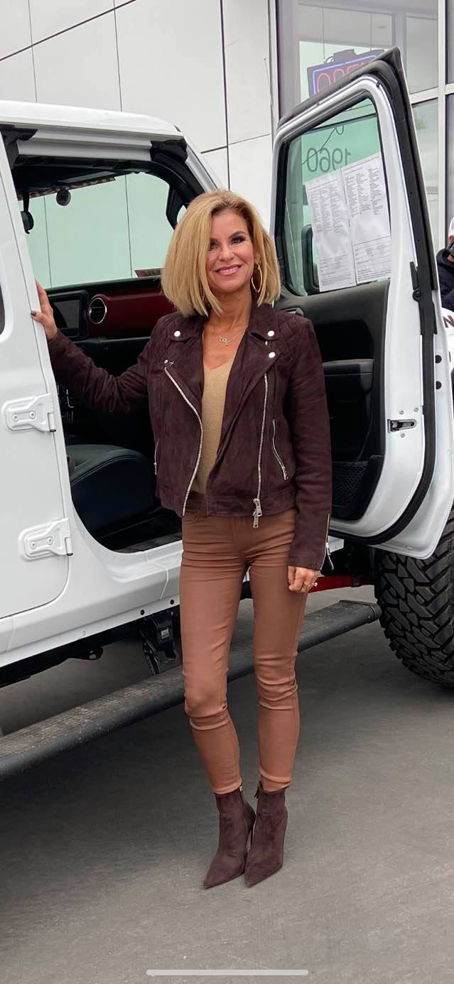 Picture of Elizabeth Theroux with one of her cars 