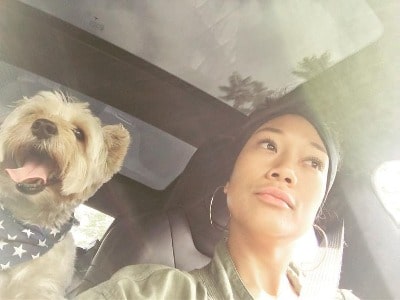 Shelby Rabara with her pet dog Charlie in their car