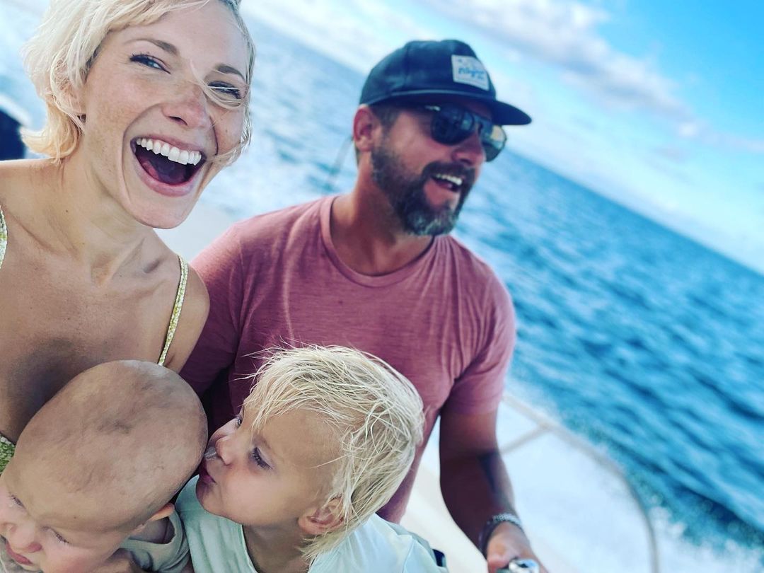 Picture of Zachary Knighton, his wife Betsy Phillips, and their child Bear Analu Knighton