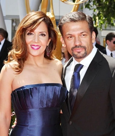 Maria Canals-Barrera and her husband David Barrera hugging each other 