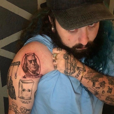 Ruby da Cherry has inked tattoos on both of his hands.