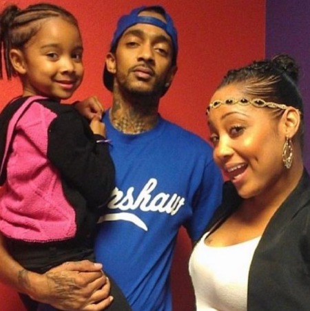 Emani Asghedom with her parents Nipsey Hussle and Tanisha Foster.